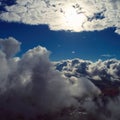 Drone flying above clouds with a beautiful sun in the sky Royalty Free Stock Photo