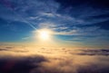 Drone flying above clouds with a beautiful sun in the sky Royalty Free Stock Photo