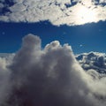 Drone flying above clouds with a beautiful sun in the sky Royalty Free Stock Photo