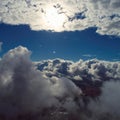Drone flying above clouds with a beautiful sun in the sky Royalty Free Stock Photo