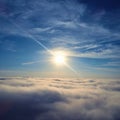 Drone flying above clouds with a beautiful sun in the sky Royalty Free Stock Photo