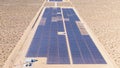 DRONE: Flying above long rows of photovoltaic panels installed in United States. Royalty Free Stock Photo