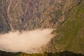 Drone flying above mist and rough turain near Mount Kasbegi and Stepantsminda in Northern Georgia