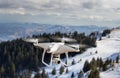 Drone flying above mountain top in winter Royalty Free Stock Photo