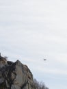 drone flying against a blue sky in a marble quarry