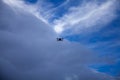 Drone flying in the blue sky with white clouds in the background Royalty Free Stock Photo