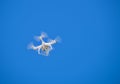 Drone flying against blue sky Royalty Free Stock Photo