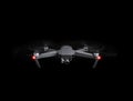 Drone - Flying in the dark, on black background. Closeup on dark. Portable drones, View on the drones gimbal and camera