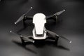 Drone - Flying in the dark, on black background. Closeup on dark. Portable drones, View on the drones gimbal and camera