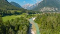 DRONE: Flying above a gorgeous mountain stream running through the countryside Royalty Free Stock Photo