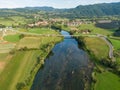 DRONE: Flying high above a group of friends paddling a canoe down river Krka Royalty Free Stock Photo