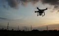 Drone flying near electricity power lines tower Royalty Free Stock Photo