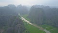 DRONE: Flying over the spectacular rocky cliffs surrounding the large river. Royalty Free Stock Photo