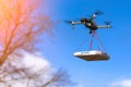 DRONE IS FLYING WITH A PIZZA Royalty Free Stock Photo