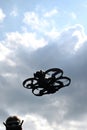 Drone is flying in the sky. Operator controls the drone Royalty Free Stock Photo