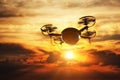 Drone flying at sunset. Sun shining on dramatic sky. Royalty Free Stock Photo