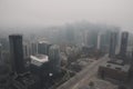 drone flyover of busy cityscape, with skyscrapers and bustling streets in view