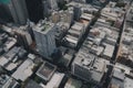 drone flyover of busy cityscape, with skyscrapers and bustling streets in view