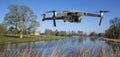 Drone flys by the lake at Lydiard House, Lydiard Park Swindon, Wiltshire