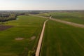 Drone footage of agricultural fields and dirt road