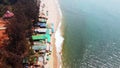 Drone footage Fly over the beautiful deserted Kerim Beach with a beach shack in Goa India at sunny day
