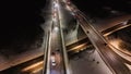 Drone footage of high intensity roadway during winter night