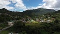 Drone footage over the small mountainside town of Adjuntas on a cloudy day, Puerto Rico