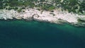 Drone footage reveals Mediterranean, coast at Mersin with clear waters. Aerial view captures rocky Mediterranean, coast
