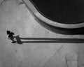 Drone grayscale shot of TX Skater at the skate park casting long shadow in Austin city