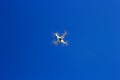 The drone is high in blue sky