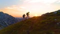 DRONE: Hiker couple enjoying an evening trip in the breathtaking Julian Alps.