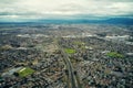 Drone, horizon and city sky with highway, mountains and landscape of buildings with nature. Society, development and Royalty Free Stock Photo