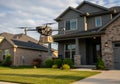 A drone is hovering in front of a modern suburban house, Royalty Free Stock Photo