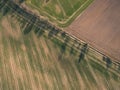 drone image. aerial view of rural area with fields and forests and water reflections in river in cloudy spring day. latvia - Royalty Free Stock Photo