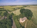 drone image. aerial view of rural area with fields and forests and water reflections in river in cloudy spring day. latvia - Royalty Free Stock Photo