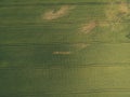 drone image. aerial view of rural area with fields and forests and water reflections in river in cloudy spring day. latvia - Royalty Free Stock Photo