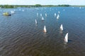 Drone image of a lake in Friesland with many small sailboats