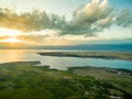 Drone Image at Sunset Over Lake With Clouds and Sun