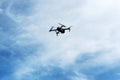 Drone flying against blue sky Royalty Free Stock Photo