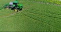 4K Drone Aerial Farm Tractor Enters And Exits Frame