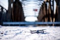 Drone landed on the snow on the railway bridge in Santakos