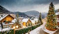 Drone landscape with snow-covered houses welcoming Christmas