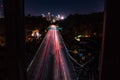 Drone long exposure shot over car lights in downtown Los Angeles with trees at night Royalty Free Stock Photo