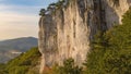 DRONE: Man climbs a challenging rock wall in Crni Kal on a beautiful day in fall