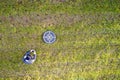 Drone operator aerial view with landing and take off target pad must register flying quadcopter Royalty Free Stock Photo