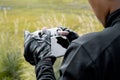 Drone operator holding remote controller in his hands