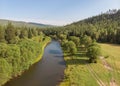 Drone over a river, country road and forest. Aerial amazing view of streams Royalty Free Stock Photo