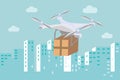 Drone with package box flying above the city and delivering the shipment Royalty Free Stock Photo