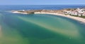 Drone panning over the Portuguese coastal town of Bairro Monte Vistoso and the Rio Mira