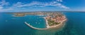 Drone panorama over the Croatian coastal town Novigrad with harbor and promenade taken from the sea side during the day